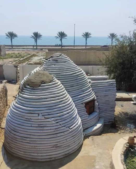 a two-domed superadobe before going through covering phase